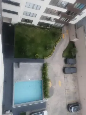 an aerial view of a swimming pool in a building at Mini departamento lujo in Lima
