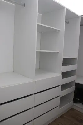 a white closet with white drawers at Casa Z Paracas in Paracas