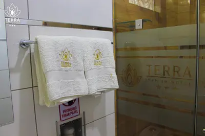 a towel hanging on a door in a hotel room at Terra Premium Hotel in Huánuco