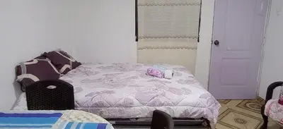 a bedroom with a bed with hello kitty items on it at LA POSADA CHASQUI Perú in Lima