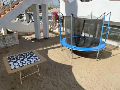 a trampoline with a net on a patio at Casa de Campo - Fundo Raquel in Ica