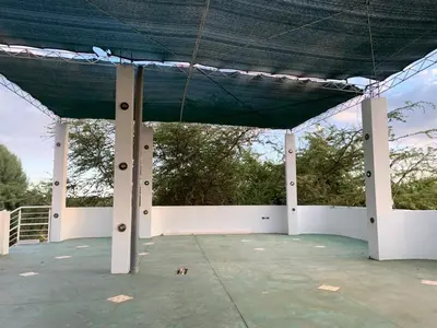 a tent with a dog under it at Casa de Campo - Fundo Raquel in Ica