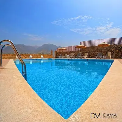 a swimming pool with blue water in a resort at Casa Dama in Cieneguilla
