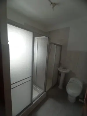 a bathroom with a shower and a toilet at Inti Wasi II in Cusco