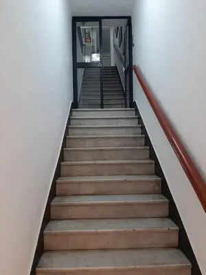 a set of stairs leading up to a building at Plaza Mayor Lima in Lima