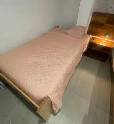 a small bed in a corner of a room at Huancayo Suite 4-Cómodo MiniDpto 2 camas in Huancayo