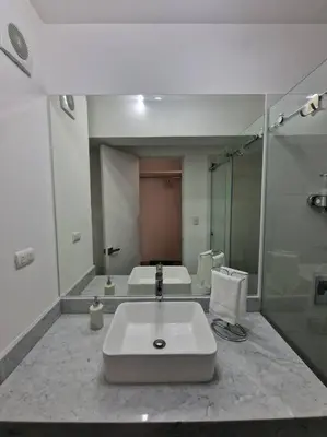 a large bathroom with a sink and a shower at Barranco Aparment Luxury in Lima