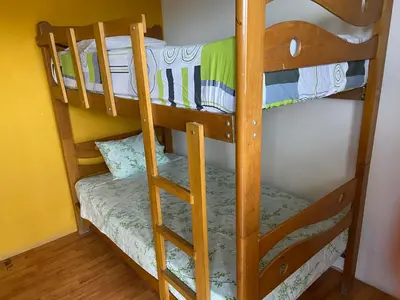 a couple of bunk beds in a room at Villa Alfonso - Casa playa con piscina temperada in Lima