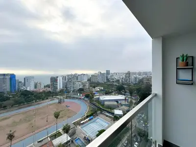 a balcony with a view of a city at Peruvian Apartments Barranco 2004 in Lima
