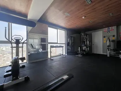 a room with a gym with a large window at Peruvian Apartments Barranco 1606 in Lima