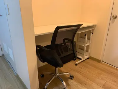 a desk with a black chair in front of a desk at Mousse PL in Lima
