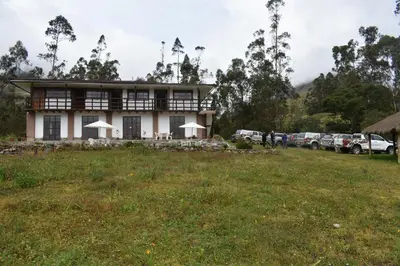 a building with a field in front of it at CasaNostra Choquequirao in Cachora