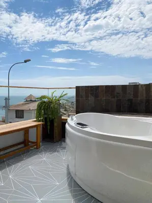 a bath tub sitting on top of a building at Kauhuhu Casa Hotel in San Bartolo