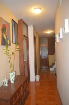a hallway of a house with a room with a hallway at Lima Guest Room House in Lima