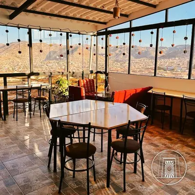 a restaurant with tables and chairs and a view at Casa Cusco guest house in Cusco