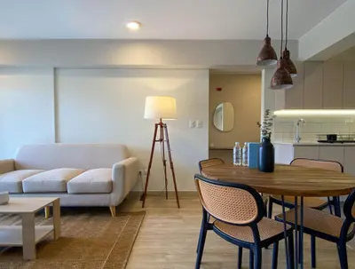 a living room with a couch and a table at Pod by Wynwood House in Lima