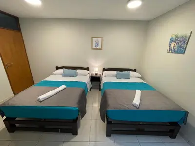 a bedroom with two beds in a room at Vianca Hotel in Machu Picchu