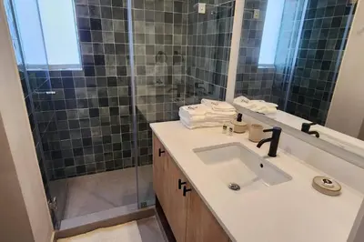 a bathroom with a sink and a shower at Amazing 3BR in Miraflores in Lima