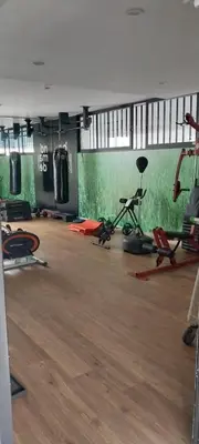a gym with exercise equipment and a wooden floor at Apartamento con increíble vista al mar in Lima