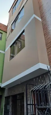 a building with a gate in front of it at Apartamento privado, comodo y amplio, cerca al Centro de Lima in Lima