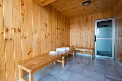 a wooden room with a bench in a wooden wall at Luxury Inkari Hotel in Lima