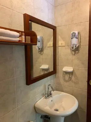 a bathroom with a sink and a mirror at Panorama B&B in Machu Picchu