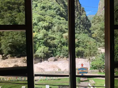 a view from a window looking out at a park at Panorama B&B in Machu Picchu