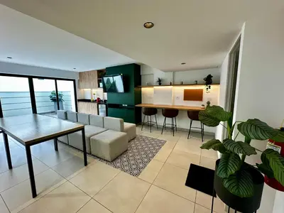 a living room with a couch and a table at Cozy Apartment in Barranco! in Lima