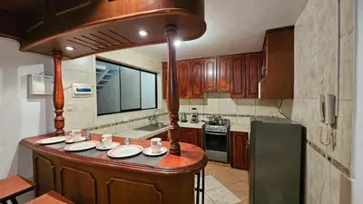 a kitchen with a large island in the middle at Casa Independiente cerca al centro historico en Primer Piso - Los Profesionales in Cusco