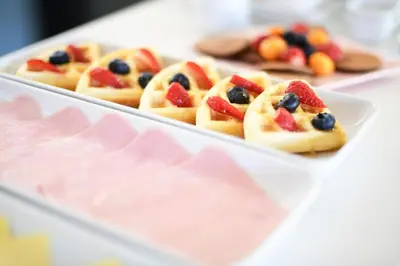 a tray of pastries with fruit on them at Tandapata Boutique Hotel in Cusco