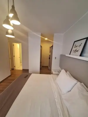 a bedroom with a large white bed in a room at Gorgeous 2BDRM with A/C - Miraflores in Lima