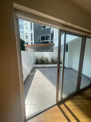 an open sliding glass door of a balcony at Gorgeous 2BDRM with A/C - Miraflores in Lima