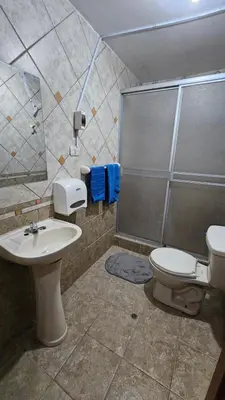 a bathroom with a toilet and a sink and a shower at Casa Independiente cerca al Centro en Segundo Piso - Los Profesionales in Cusco