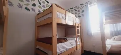 a bunk bed with two bunk beds in a room at Quinoa Backpackers Hostel in Lima