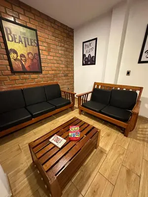 a living room with two couches and a coffee table at La Fogata del Sur in Fundo Copacabana