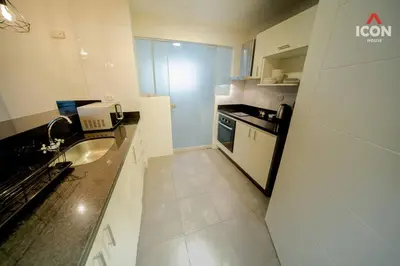 a small kitchen with a sink and a stove at Beautiful 2BR in Miraflores in Lima