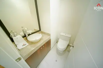 a bathroom with a toilet and a sink and a mirror at Beautiful 2BR in Miraflores in Lima