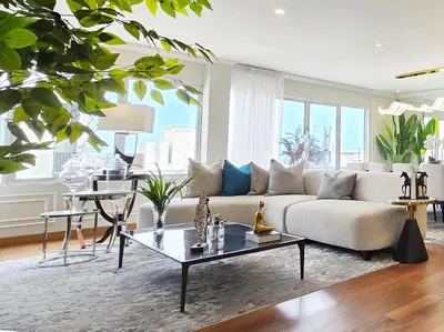 a living room with a couch and a table at Penthouse Luxe private Jacuzzi King AC in Lima