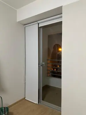 a sliding glass door in a room at Apartamento 3 habitaciones, Santa Beatriz - Perú in Lima