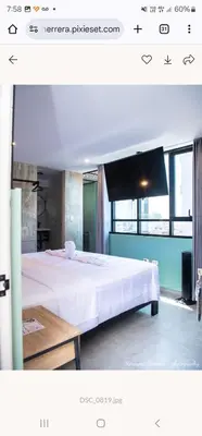 a bedroom with a large white bed in a room at LOS ARCES HOTEL in Lima