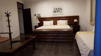 a hotel room with a bed and a desk at HOTEL RUSTICA PACHACAMAC in Lima