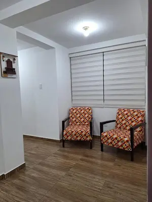 two chairs sitting next to each other in a room at Dormitorio matrimonial 01 in Lima