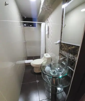 a bathroom with a sink and a toilet at Hotel Horizonte in Machu Picchu