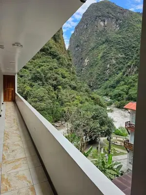 a balcony with a view of a mountain at Hotel Horizonte in Machu Picchu