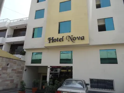 a car parked in front of a hotel nova at Hotel Nova in Lima