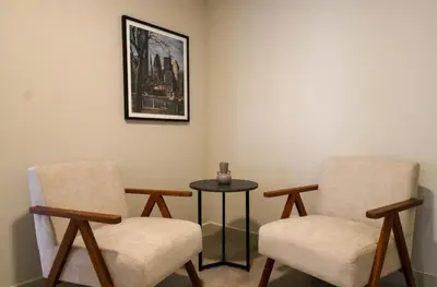 a waiting room with two chairs and a table at Soul by Wynwood House in Lima