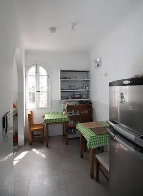 a kitchen with a table and a dining room at Casa Águila y Cóndor Miraflores in Lima