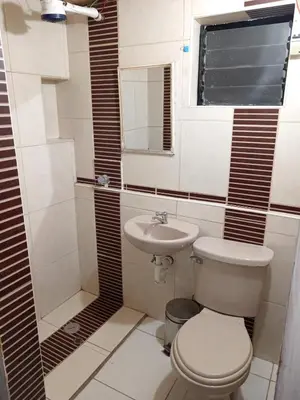 a bathroom with a toilet and a sink at HOSTAL La RASA in Cusco