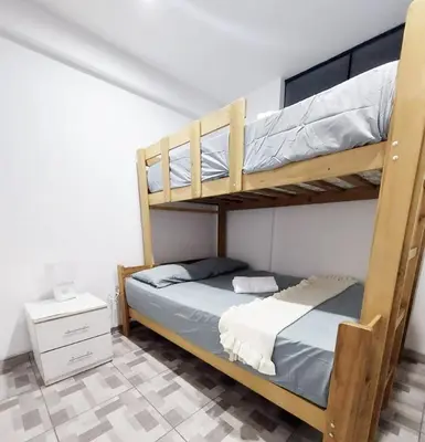 a bedroom with two bunk beds in a room at Miel de Luna in Cerro Azul