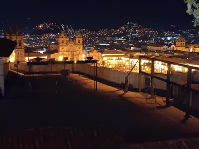 a view of a city at night with lights at Mini Apart II - Sumaq Wasi ALBA in Cusco